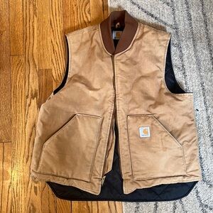 Used carhartt vest. No tags fits like an XL